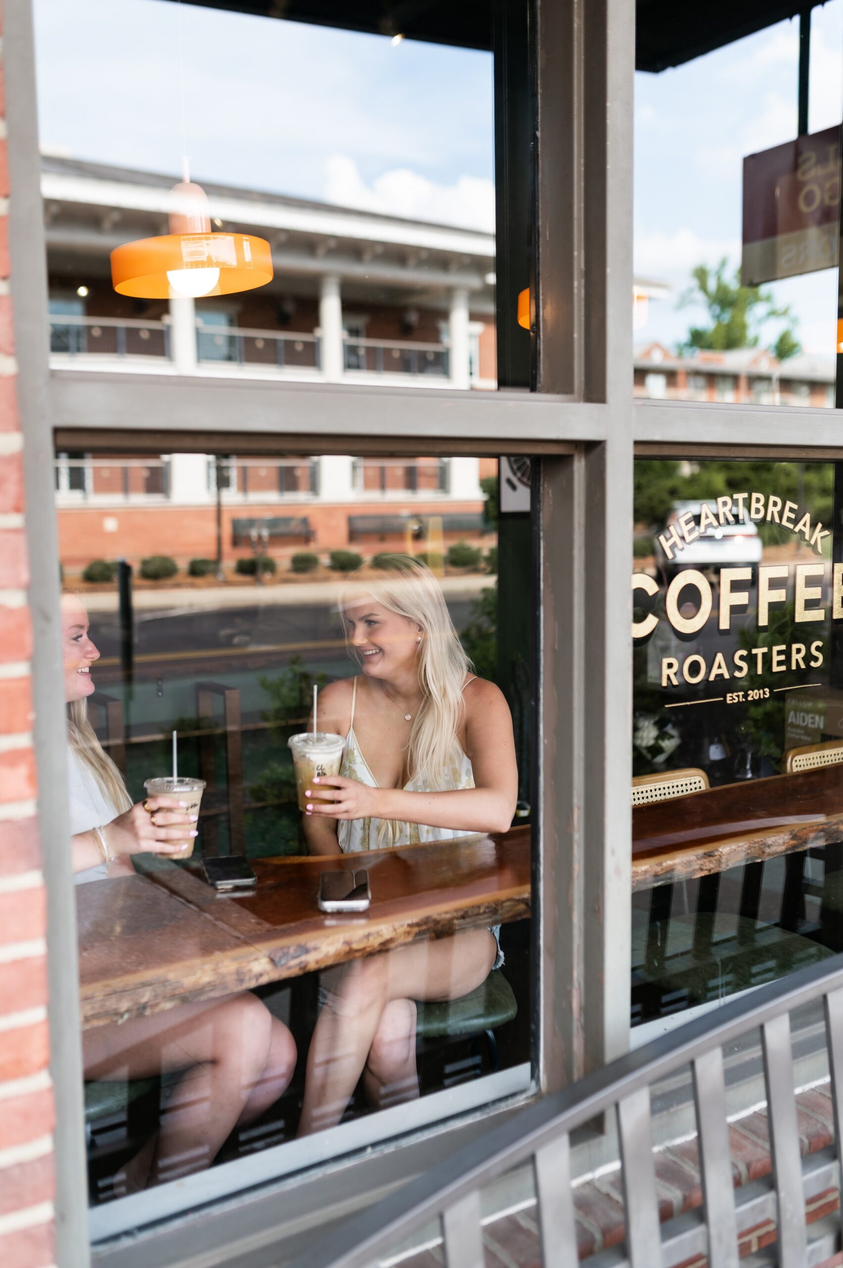 college students socializing at coffee shop scaled