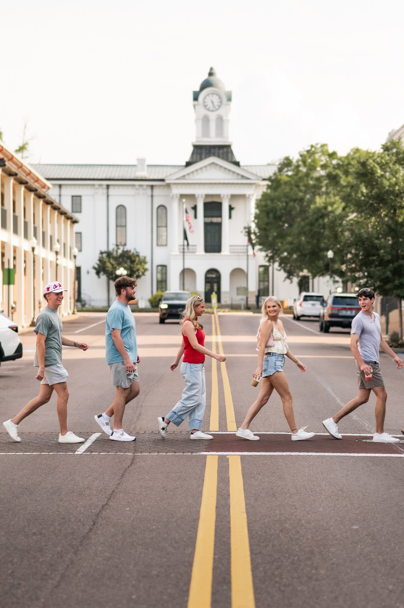 college students walking across town square scaled