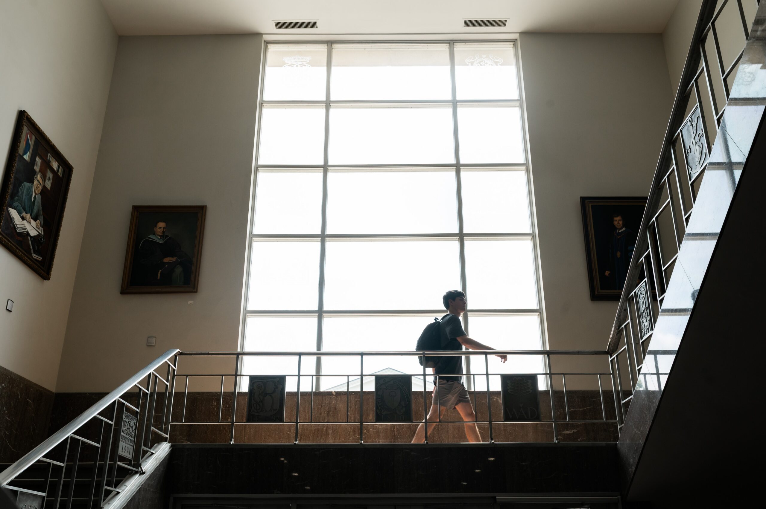 student walking across university landing scaled