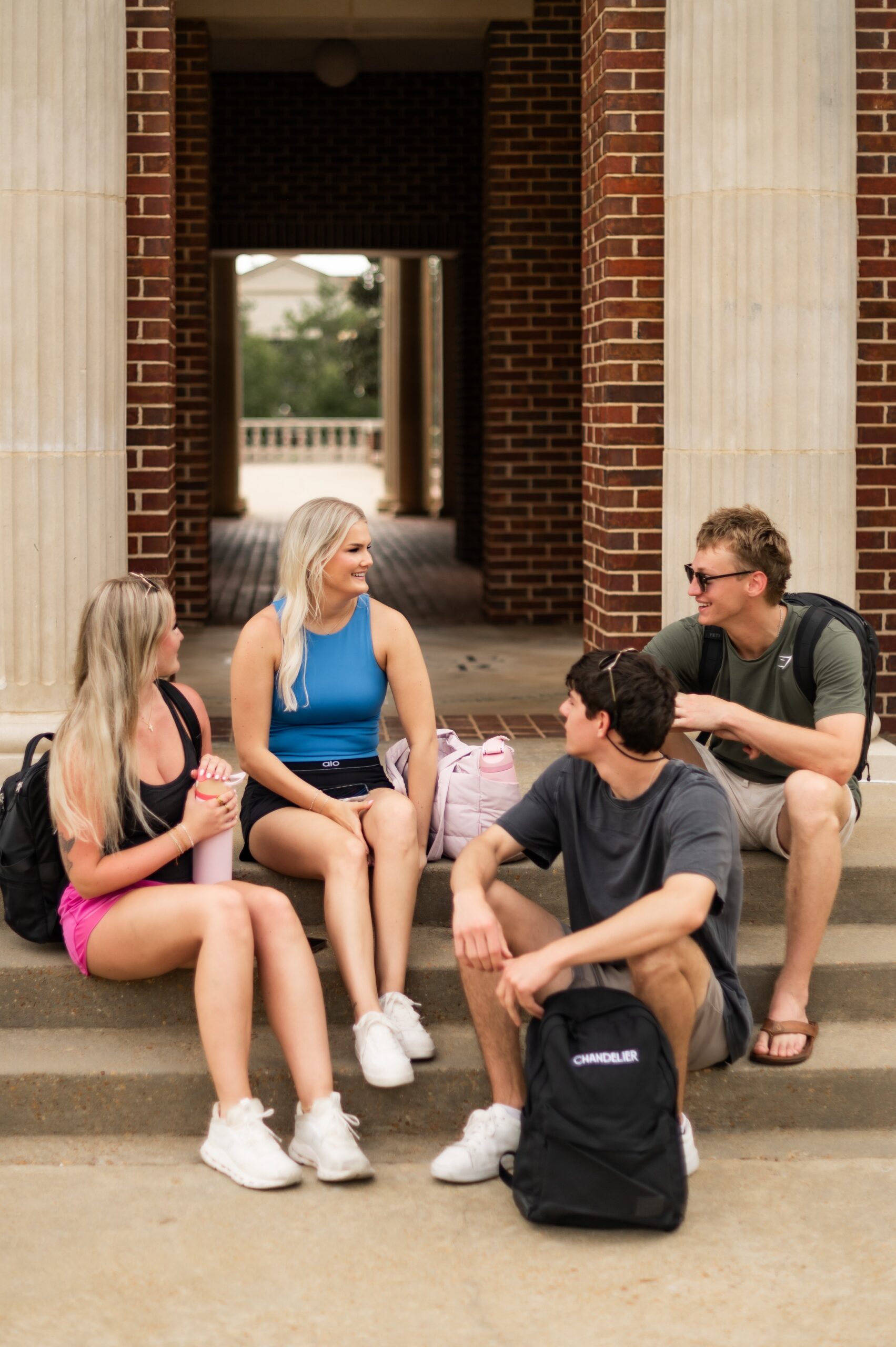 university students chatting on steps scaled