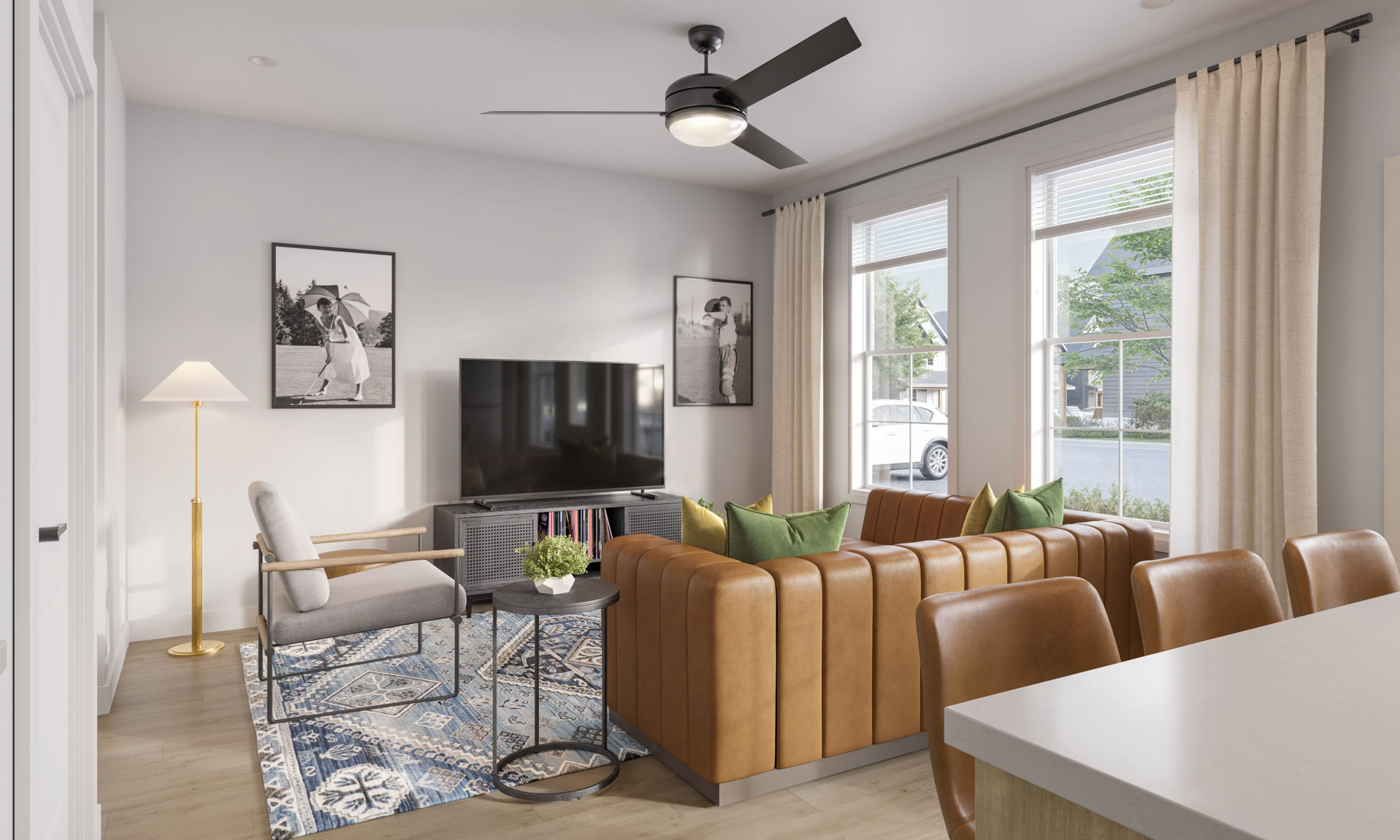 Chandelier Student Living Apartments Modern living room with brown leather sofa, gray chair, TV, framed photos, and large windows with beige curtains letting in sunlight.